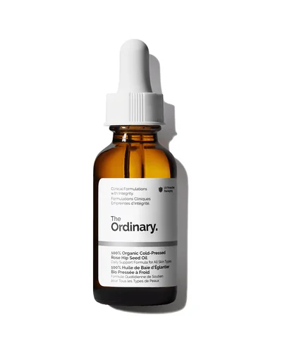 Envase de 100% Organic Cold-Pressed Rose Hip Seed Oil sobre fondo blanco