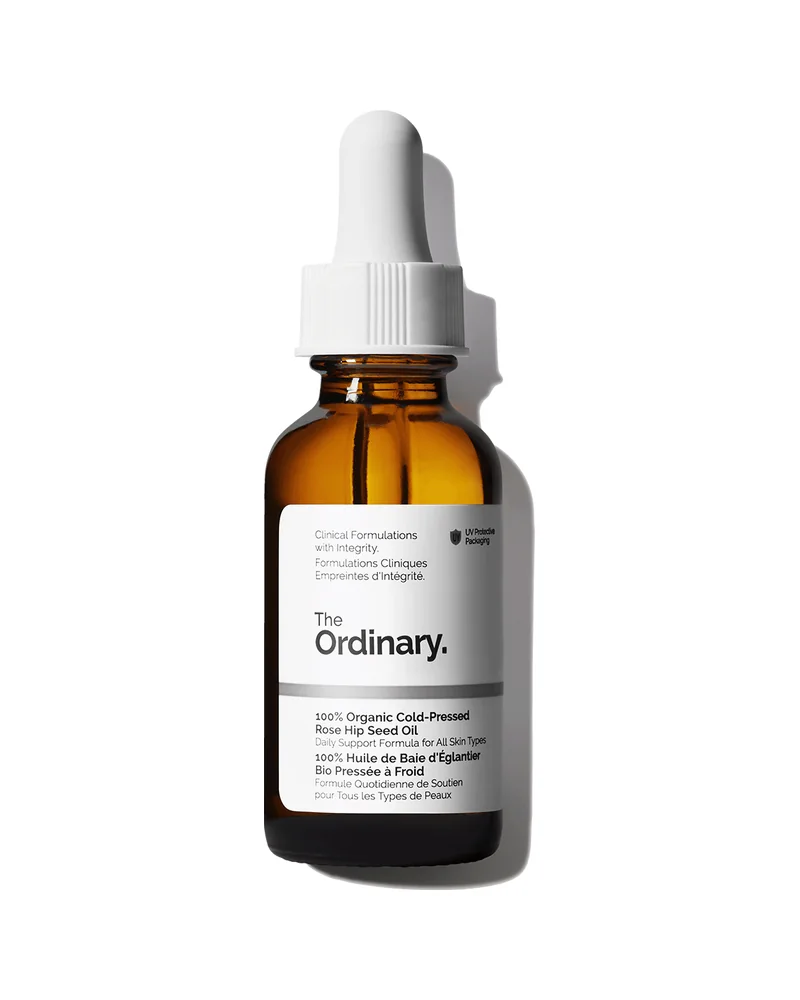 Envase de 100% Organic Cold-Pressed Rose Hip Seed Oil sobre fondo blanco