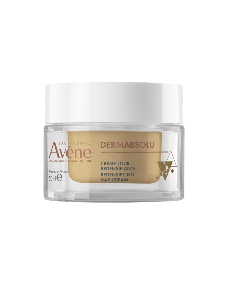 Envase de DermAbsolu Crema de día sobre fondo blanco