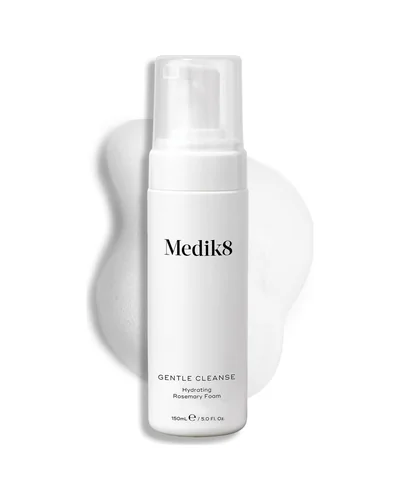 Envase de Gentle Cleanse sobre fondo blanco, con una muestra de la textura al lado