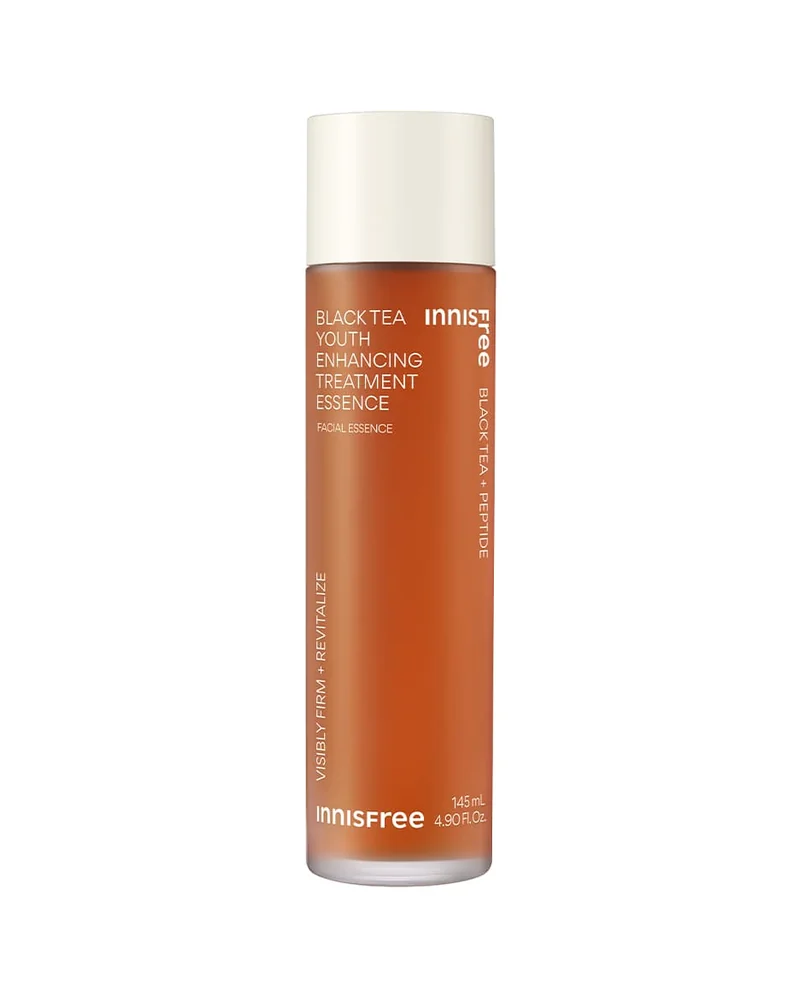 Frasco de Black Tea Youth Enhancing Treatment Essence sobre fondo blanco