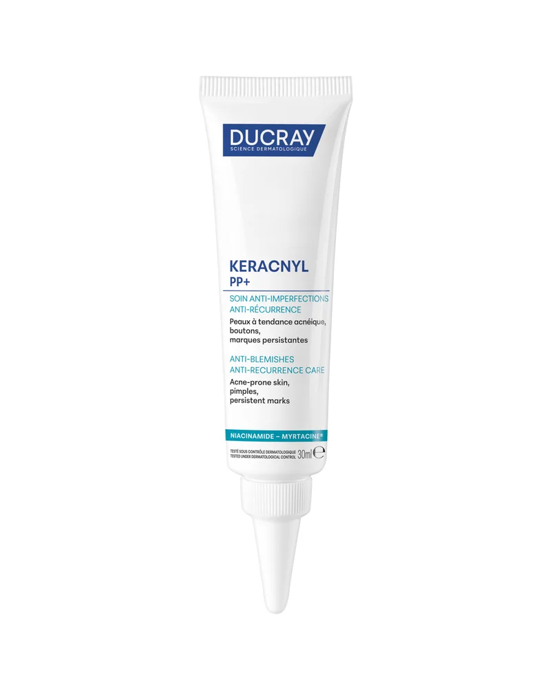 Envase de Keracnyl PP+ Crema antiimperfecciones sobre fondo blanco
