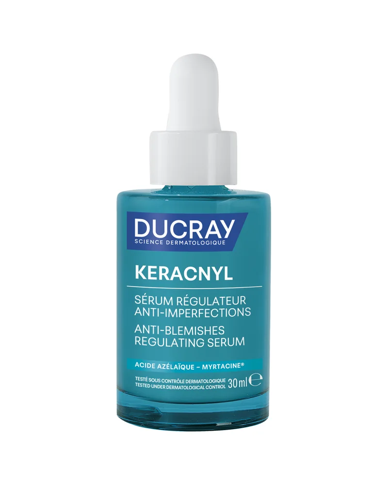 Envase de Keracnyl Sérum regulador antiimperfecciones sobre fondo blanco