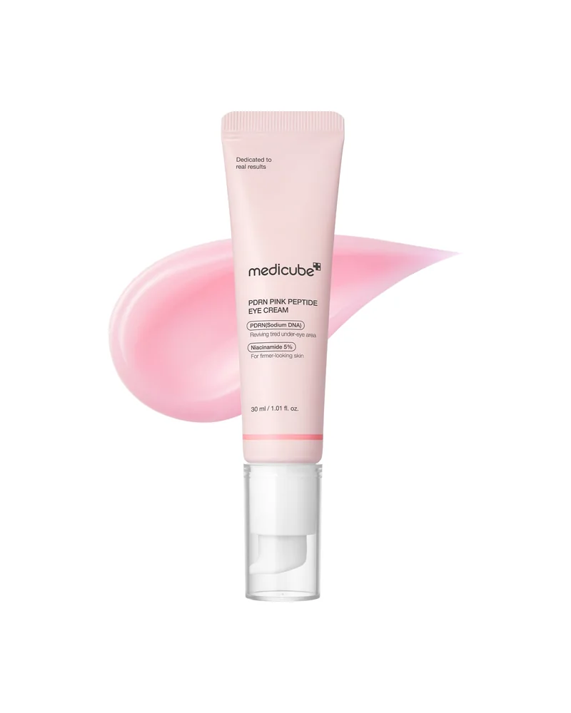 Tubo de PDRN Pink Peptide Eye Cream con un trazo de crema rosa detrás