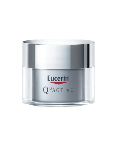 Envase de Q10 Active Crema de Noche sobre fondo blanco