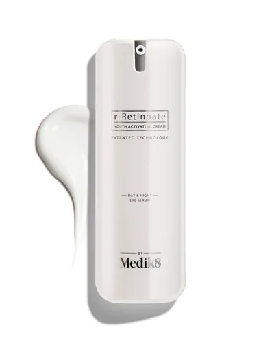 Envase de r-Retinoate Day & Night Eye Serum sobre fondo blanco, con una muestra de la textura al lado